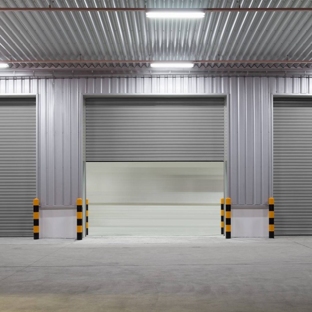 A commercial garage door open halfway